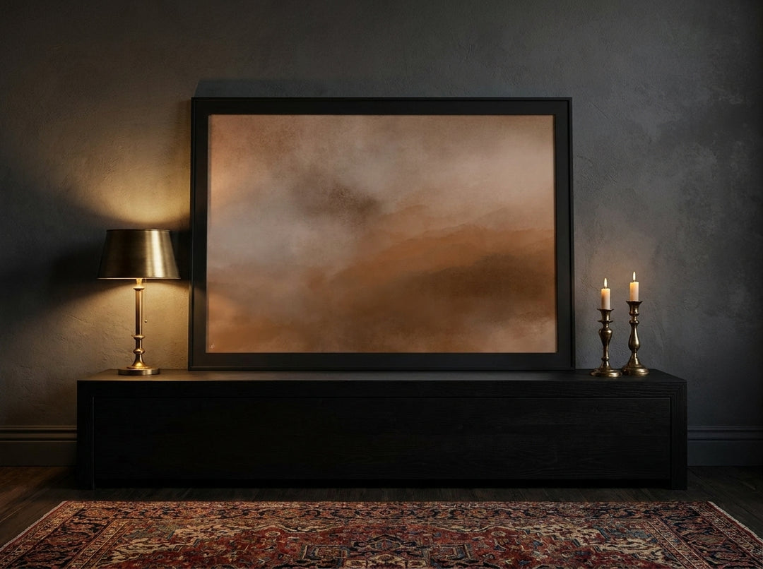 Modern wall art print standing on a console in a moody living room