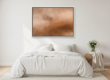 Canvas wall art with a white surround styled on the wall in a bright Scandinavian bedroom