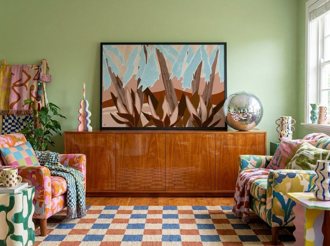 Modern wall art print standing on a sideboard in a colourful eclectic living room