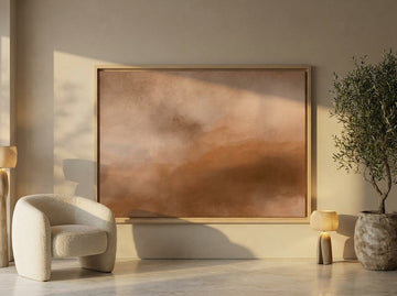 Oversized statement canvas wall art with a natural timber surround leaning against the wall in a luxe dining room