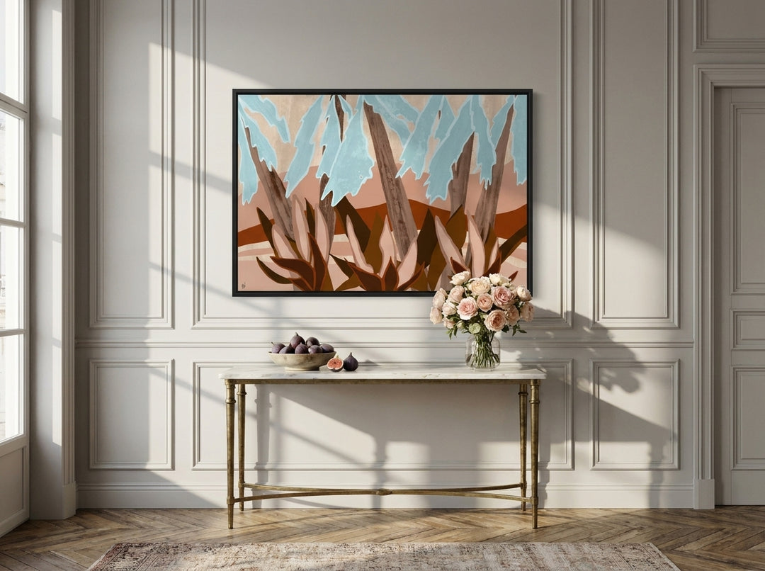 Canvas wall art with a black surround styled on the wall in a Parisian living room