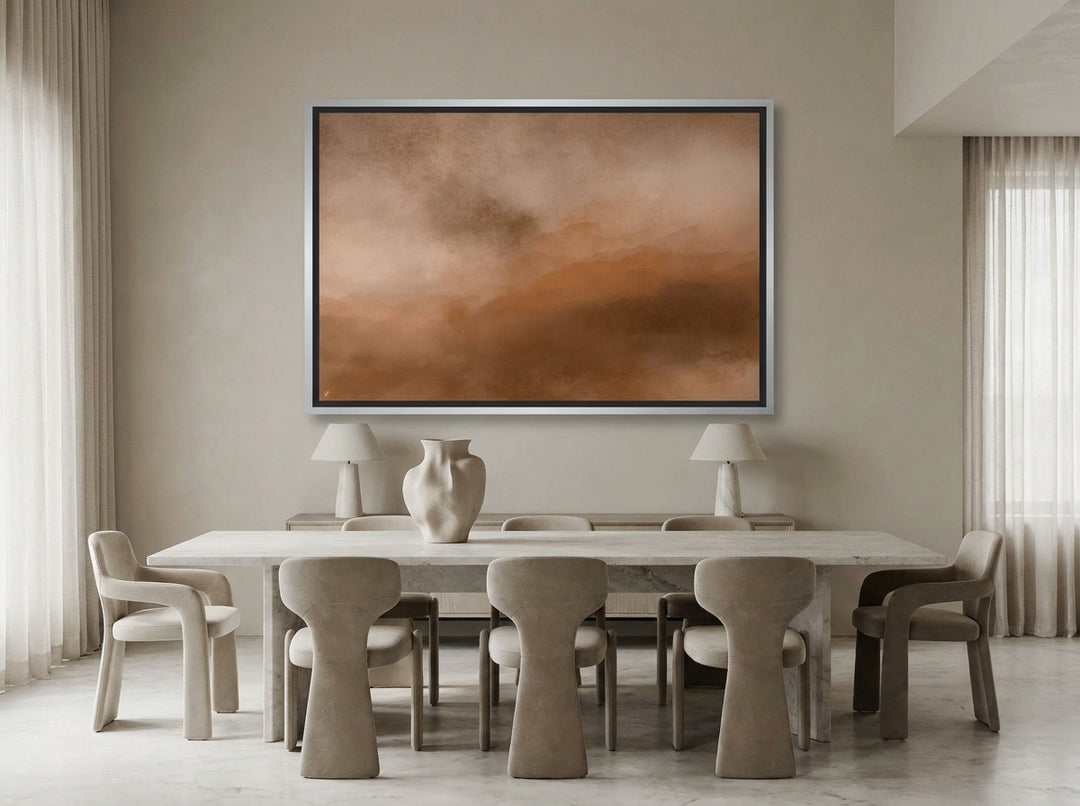 Oversized statement canvas wall art with a silver leaf surround styled on the wall in a luxe dining room