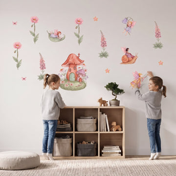 Fairy Cottage Garden Wall Sticker Decals wall decals: a girl putting the decals up in a kids' room
