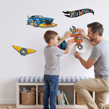 Hot Wheels Hot Rod Garage Set Wall Sticker Decals wall decals: a boy and his dad putting the decals up in a playroom