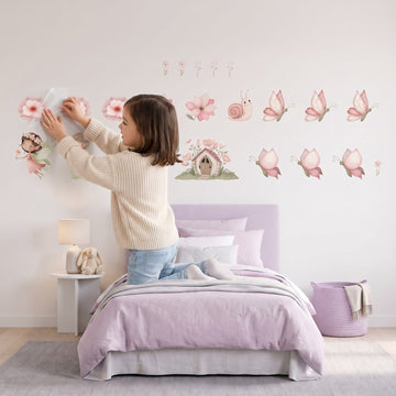 Pastel Illustration Fairy Garden Wall Sticker Decals wall decals: a girl putting the decals up in a girl's bedroom