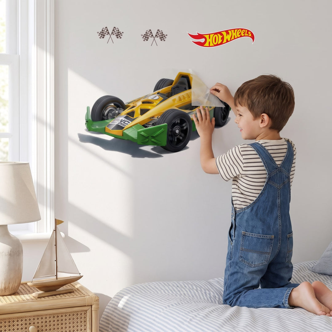 Hot Wheels Fast Lane Racer Set Wall Sticker Decals wall decals: a boy putting the decals up in a boy's bedroom
