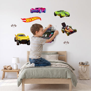 Let's Race Cars Wall Sticker Decals wall decals: a boy putting the decals up in a boy's bedroom