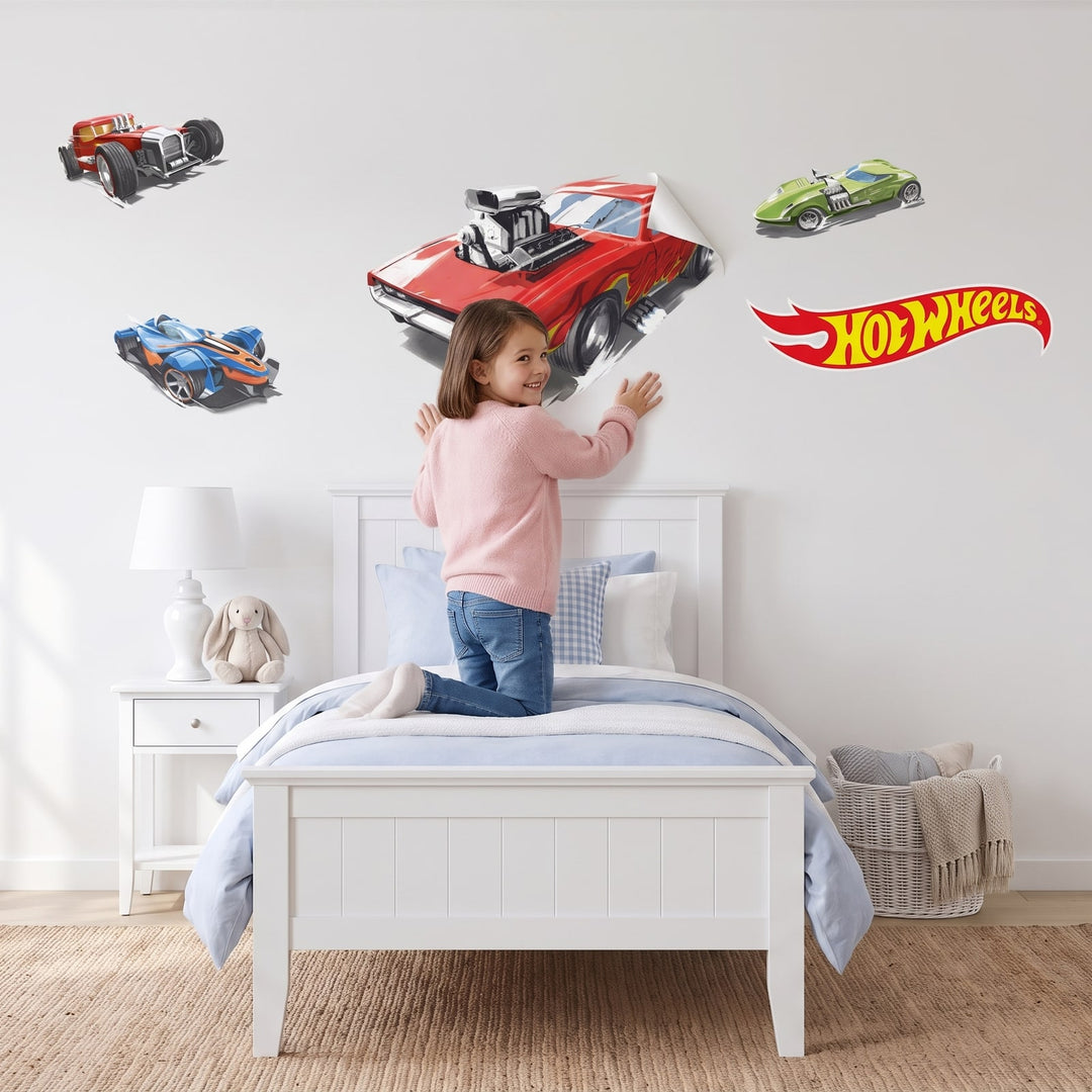 Hot Wheels Hot Rod Heroes Wall Sticker Decals wall decals: a girl putting the decals up in a girl's bedroom