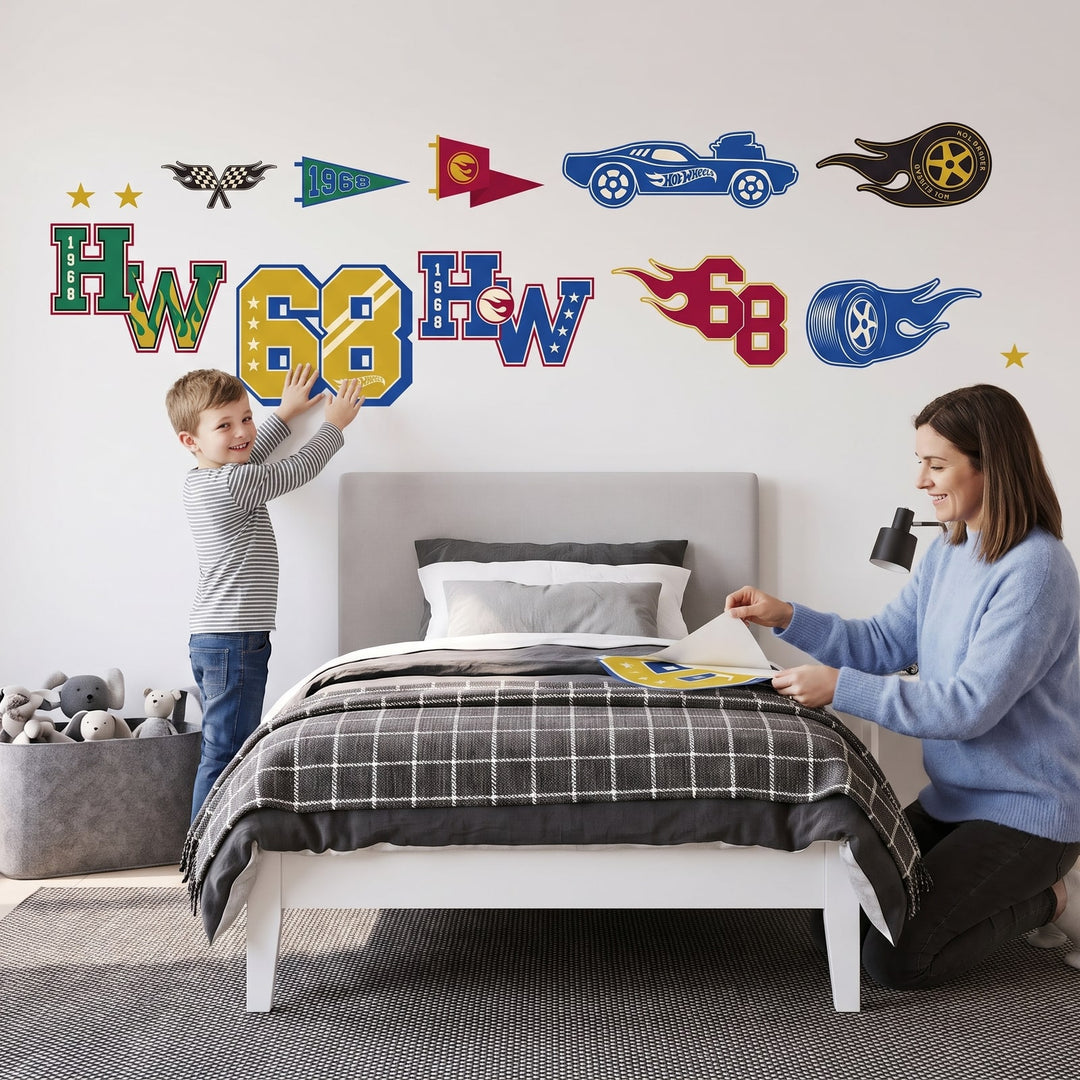 Hot Wheels Varsity Icons Wall Sticker Decals wall decals: a boy and his mum putting the decals up in a boy's bedroom