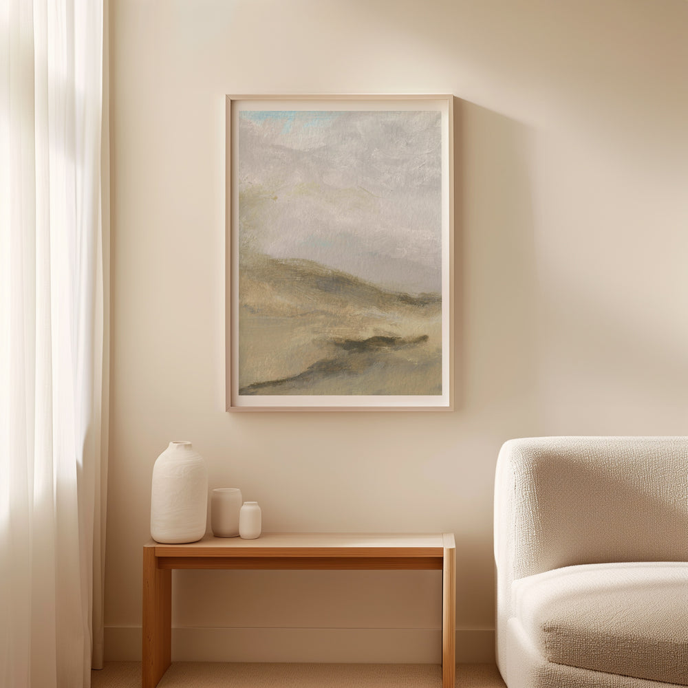 Landscape painting on a wall above a wooden side table with decorative items, next to a white sofa.