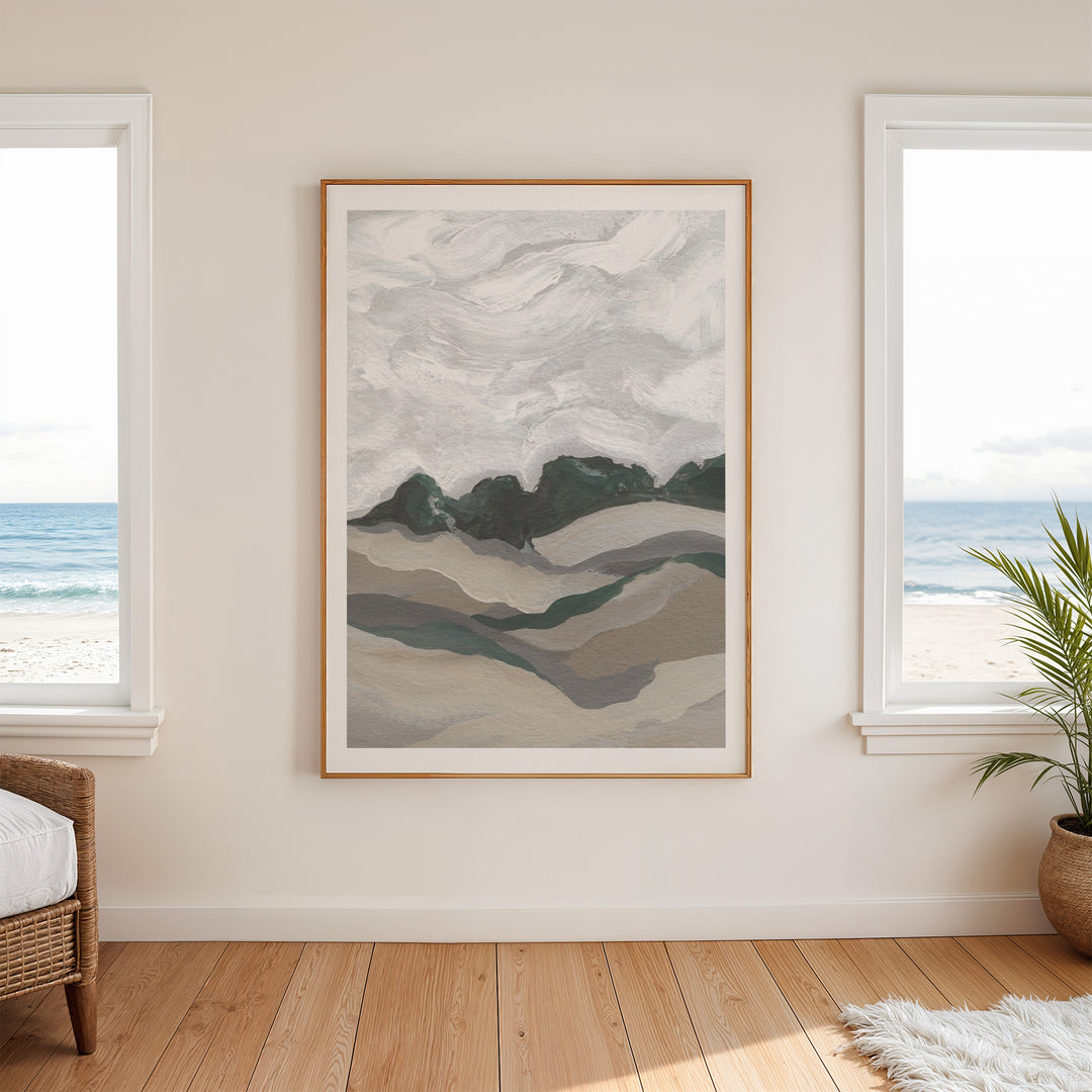 Abstract art piece on a wall with windows showing a beach view.