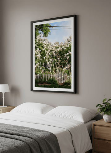 Minimalist artwork displayed in a calm, light-filled bedroom interior
