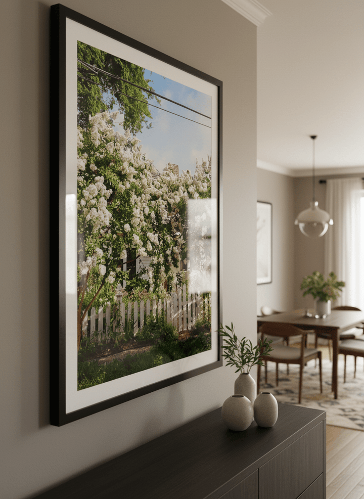 Wall art styled above a dining table in a contemporary home