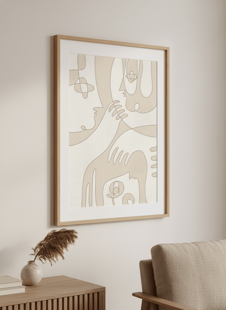 Modern wall art styled above a sofa in a neutral living room