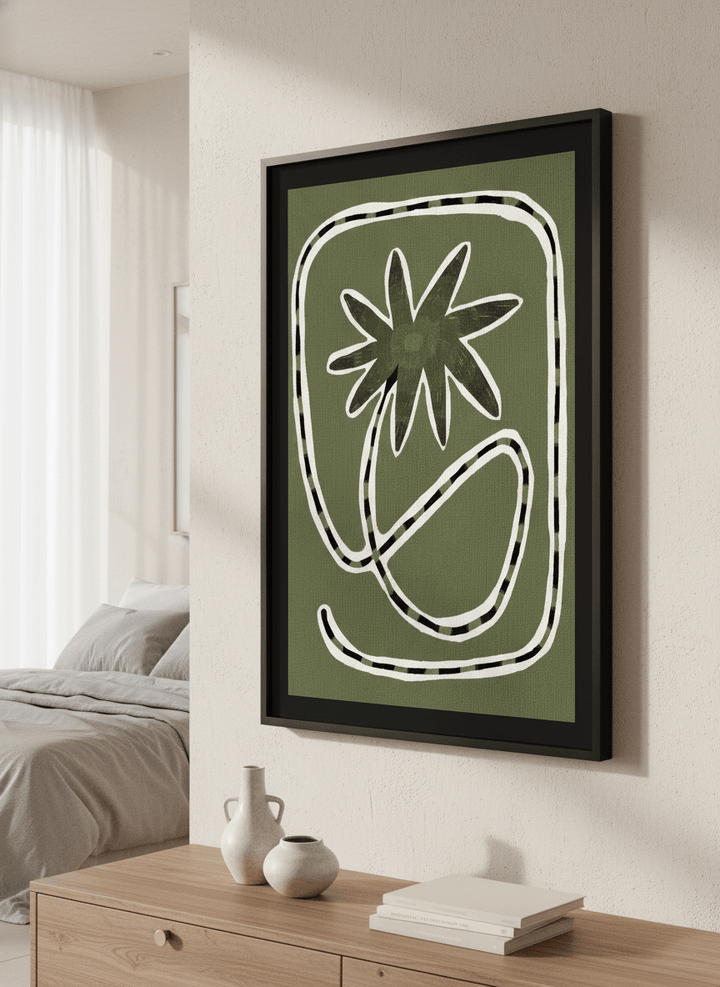 Minimalist artwork displayed in a calm, light-filled bedroom interior