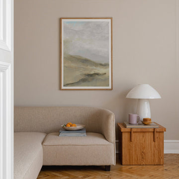 landscape artwork on top of sofa