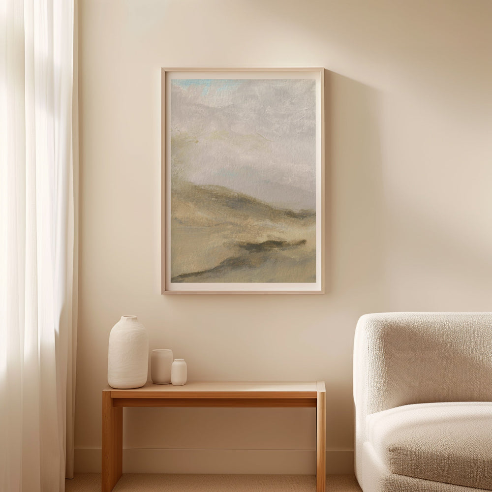 Landscape painting on a wall above a wooden side table with decorative items, next to a white sofa.