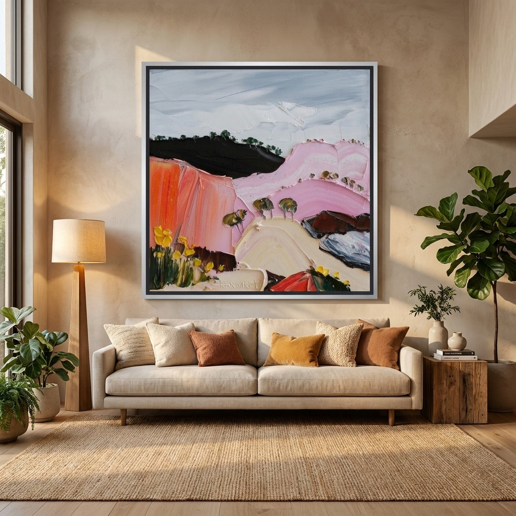 Oversized statement canvas wall art with a silver leaf surround styled in a neutral living room