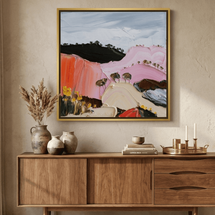 Canvas wall art with a gold leaf surround styled in a contemporary dining room