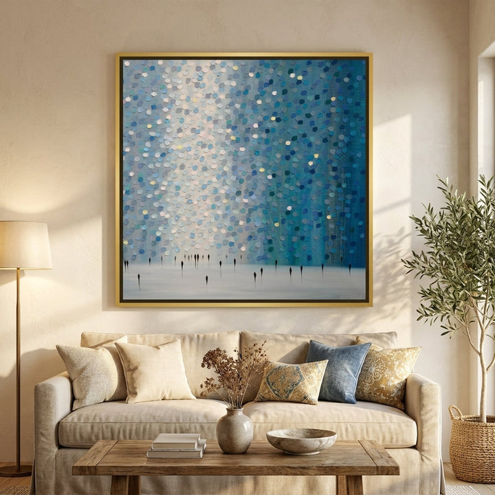 Canvas wall art with a gold leaf surround styled in a neutral living room