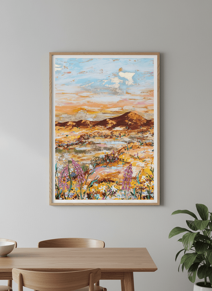 Wall art styled above a dining table in a contemporary home