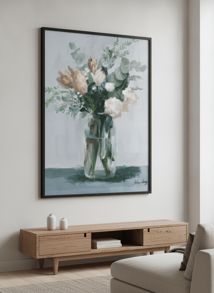 Modern wall art styled above a sofa in a neutral living room