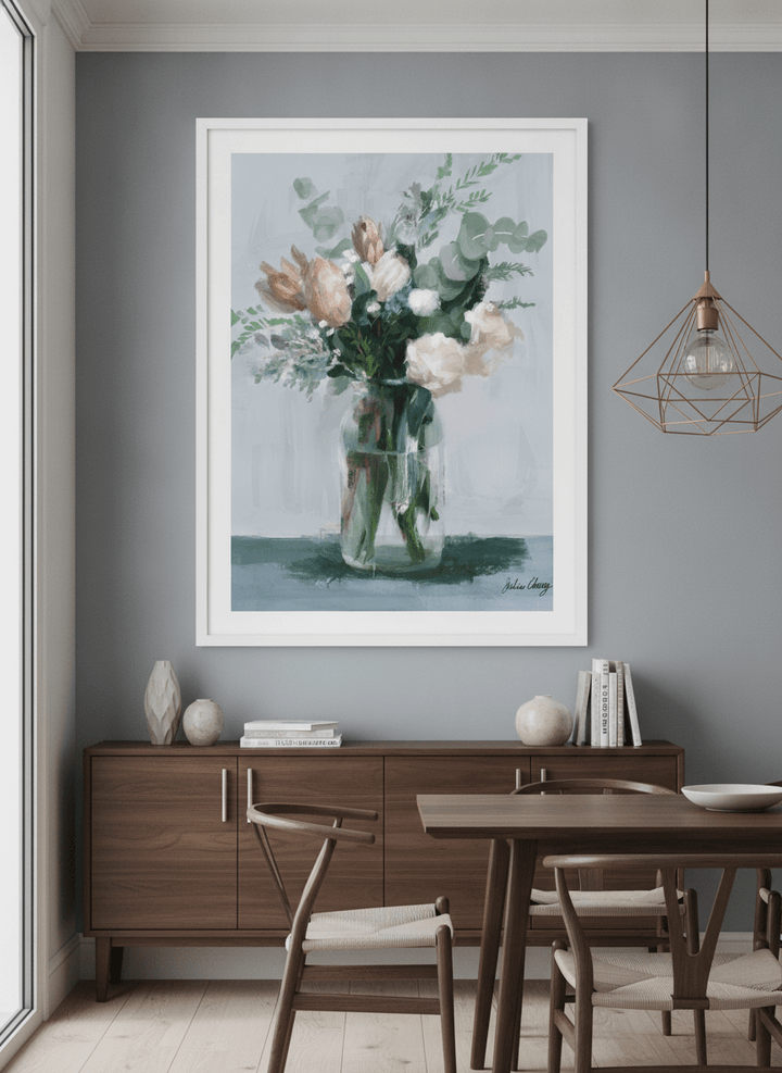 Wall art styled above a dining table in a contemporary home