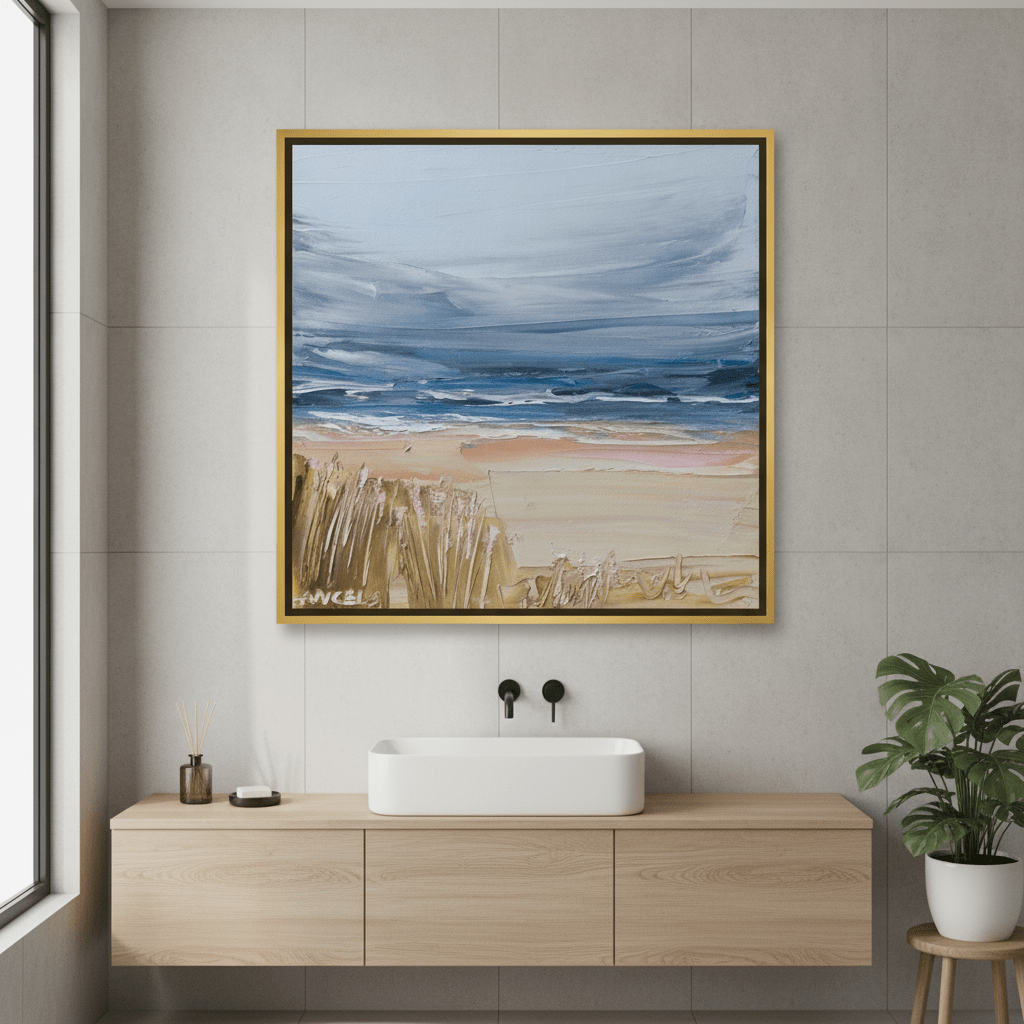 Canvas wall art with a gold leaf surround styled in a clean minimalist bathroom
