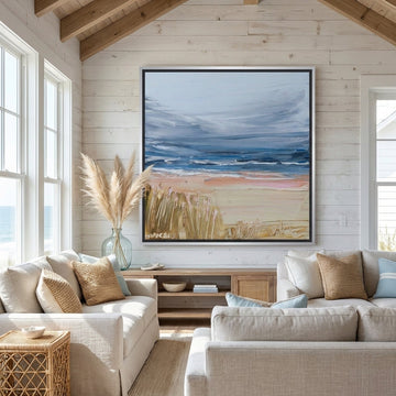 Oversized statement canvas wall art with a silver leaf surround styled in a sunny coastal beach house