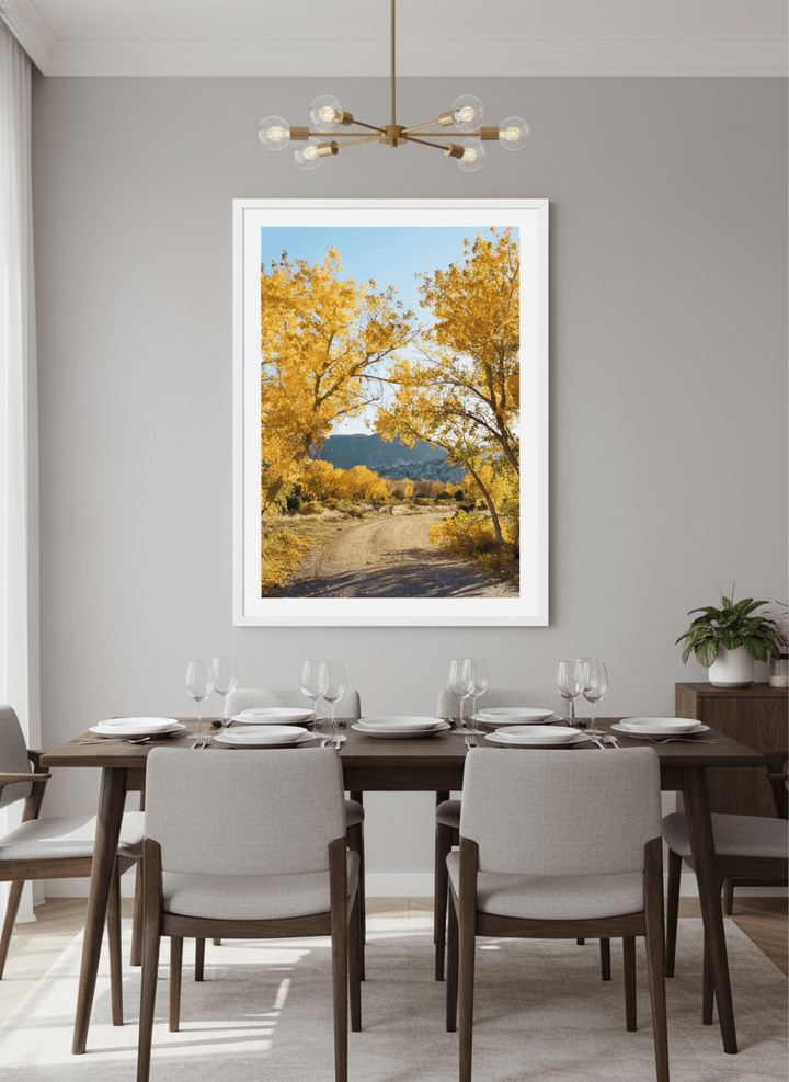 Wall art styled above a dining table in a contemporary home
