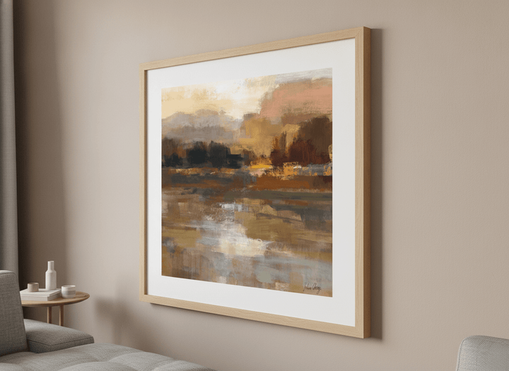Modern wall art styled above a sofa in a neutral living room