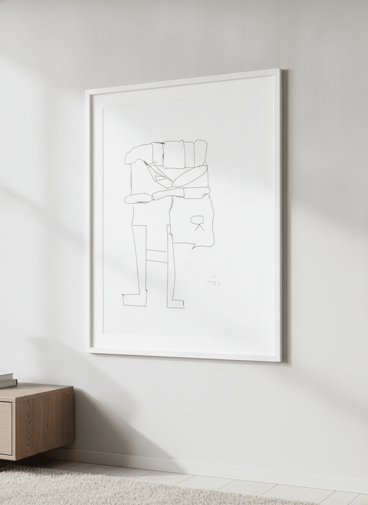 Modern wall art styled above a sofa in a neutral living room