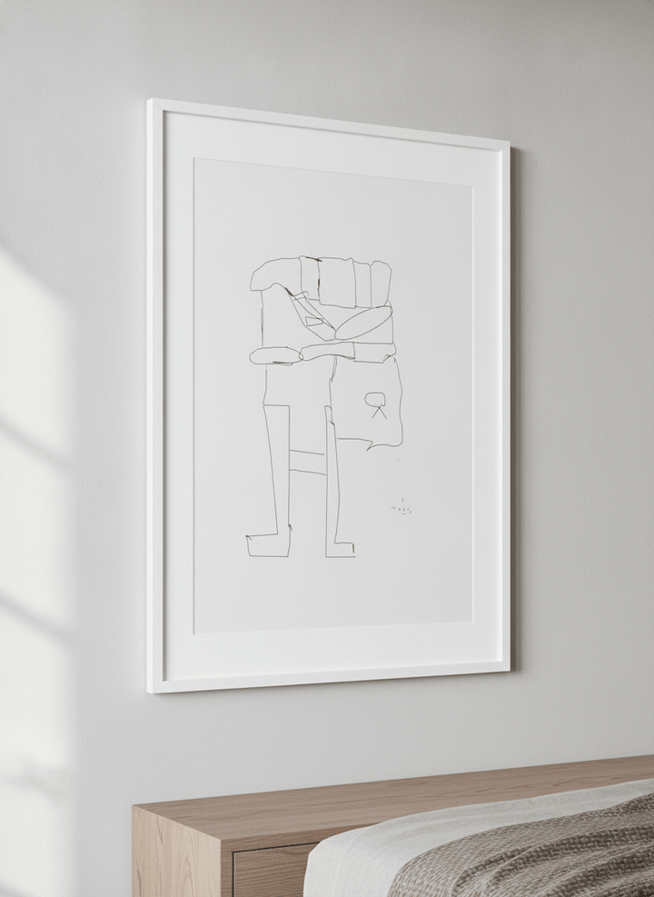 Minimalist artwork displayed in a calm, light-filled bedroom interior