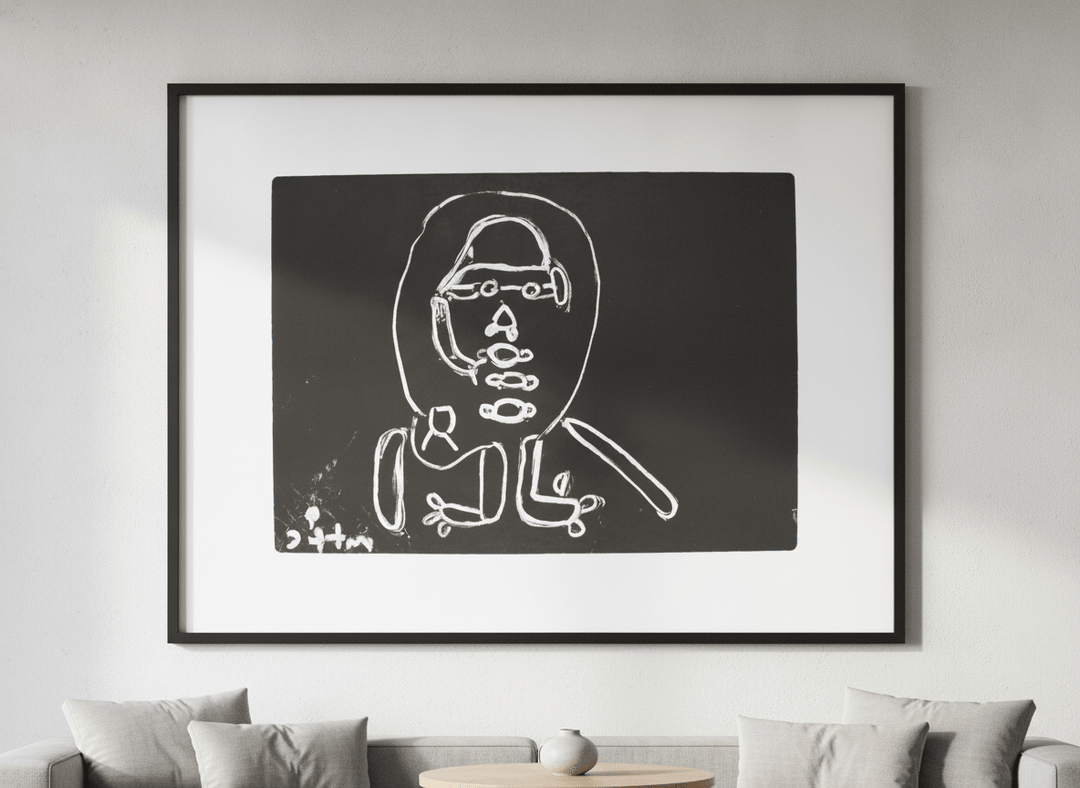 Modern wall art styled above a sofa in a neutral living room
