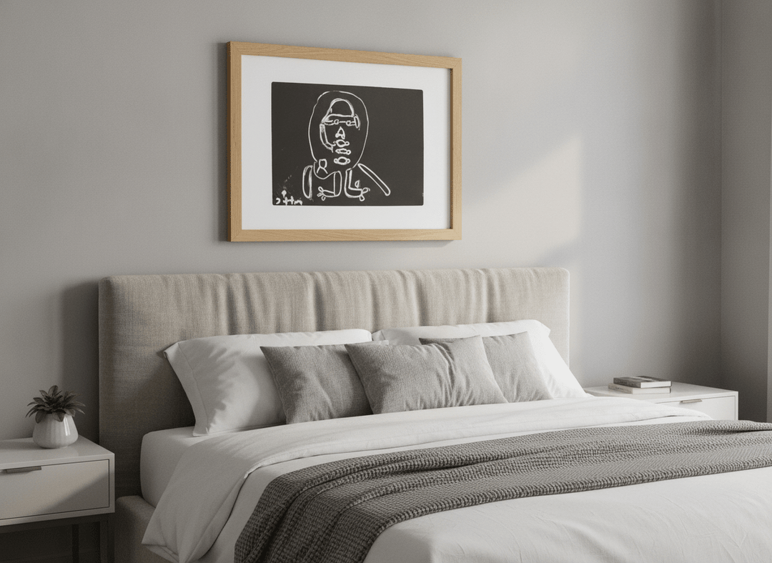 Minimalist artwork displayed in a calm, light-filled bedroom interior