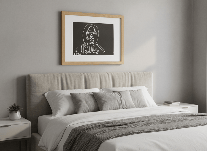 Minimalist artwork displayed in a calm, light-filled bedroom interior