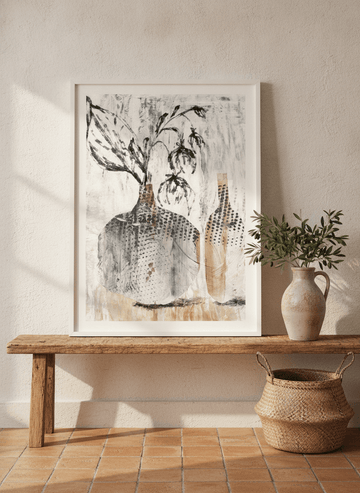 Modern wall art print standing on a bench in a Mediterranean bedroom