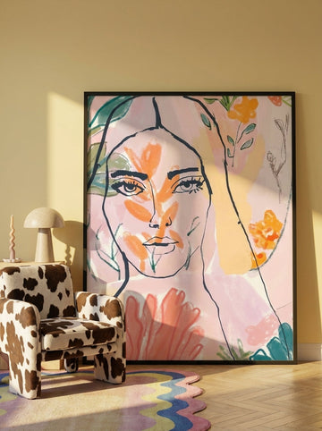 Oversized statement modern wall art print leaning against the wall in a colourful eclectic living room