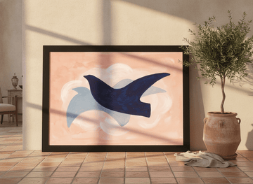 Oversized statement modern wall art print leaning against the wall in a Mediterranean dining room