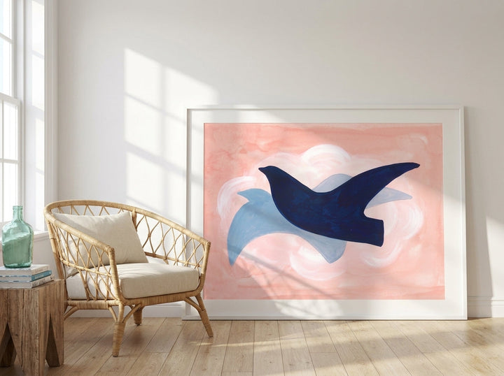 Oversized statement modern wall art print leaning against the wall in a coastal living room