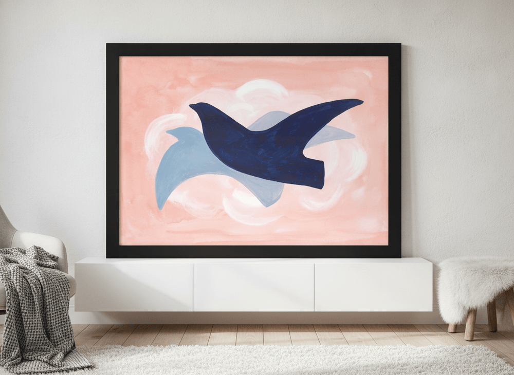 Modern wall art print standing on a sideboard in a bright Scandinavian bedroom
