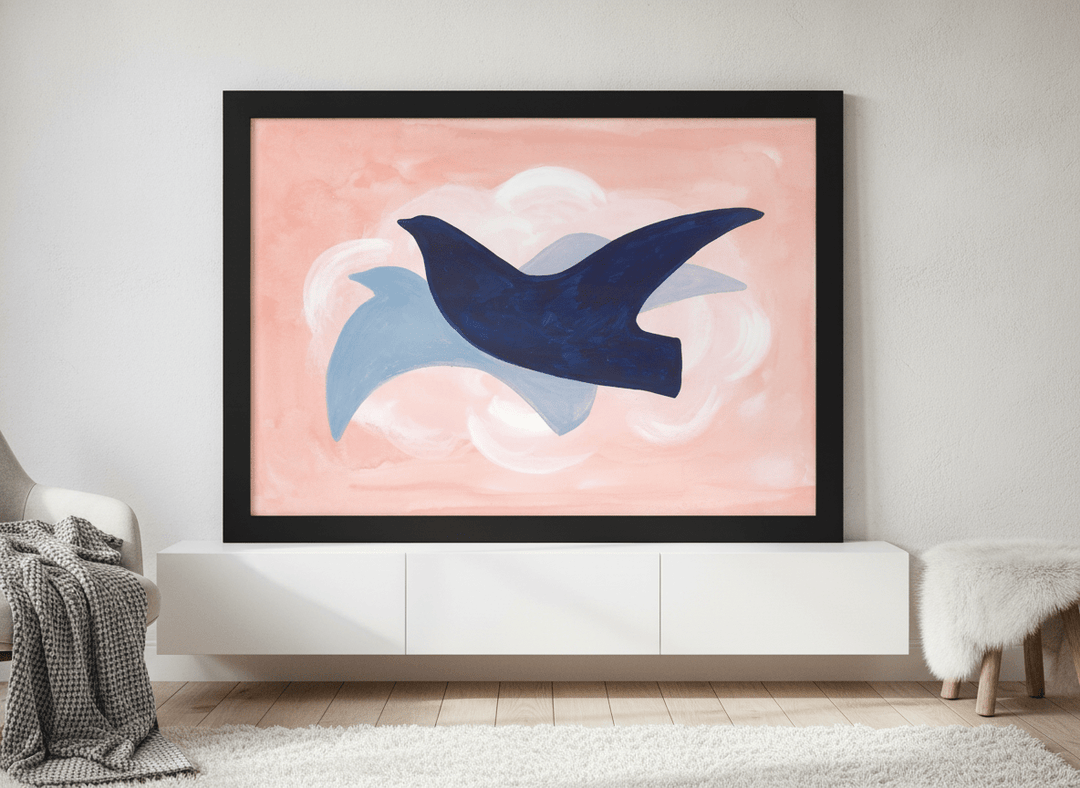 Modern wall art print standing on a sideboard in a bright Scandinavian bedroom