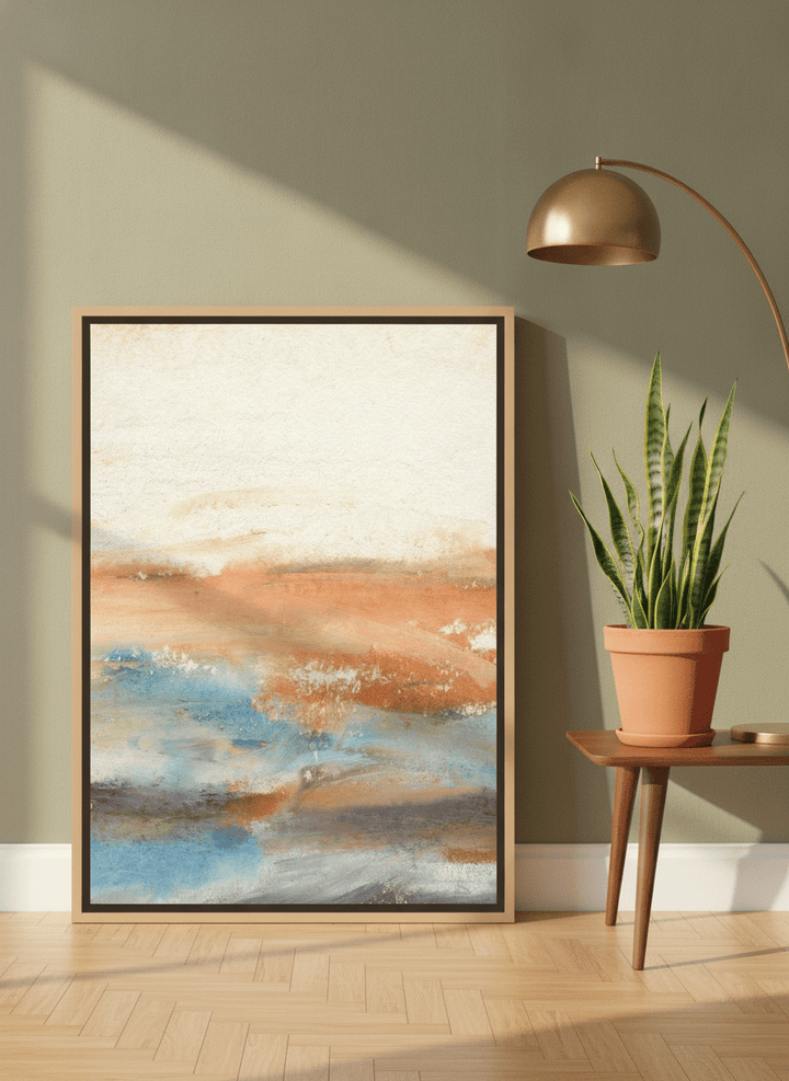 Canvas wall art with a natural timber surround leaning against the wall in a mid-century home office