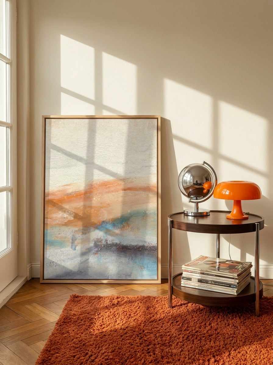 Canvas wall art with a natural timber surround leaning against the wall in a retro 70s home office