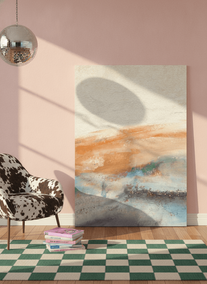 Stretched canvas wall art leaning against the wall in a colourful eclectic bedroom