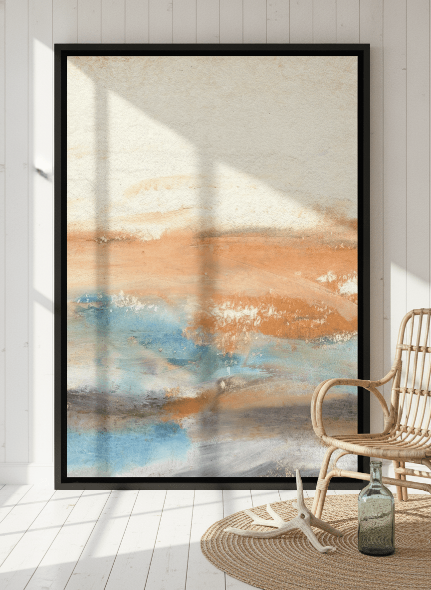 Oversized statement canvas wall art with a black surround leaning against the wall in a coastal bedroom