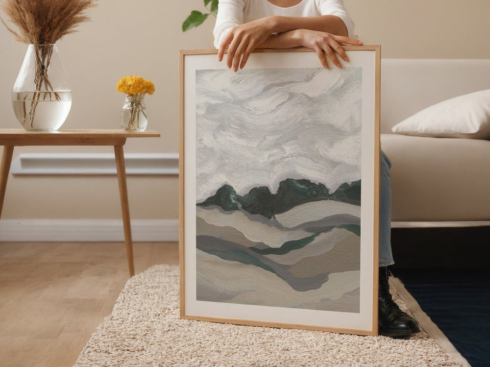 Person holding an abstract art piece in a living room.