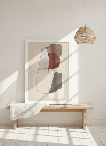 Modern wall art print standing on a bench in a bright Scandinavian home office