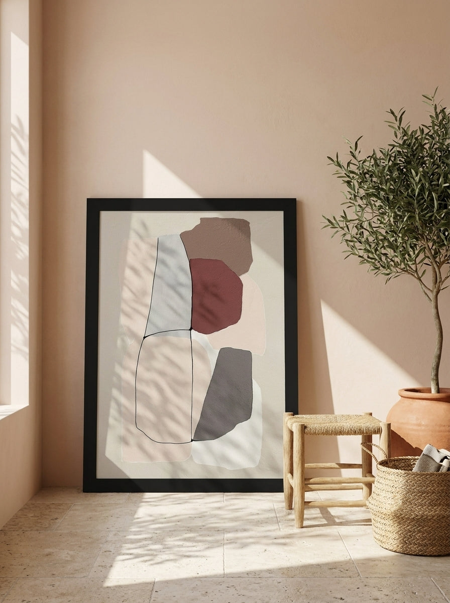 Modern wall art print leaning against the wall in a Mediterranean living room