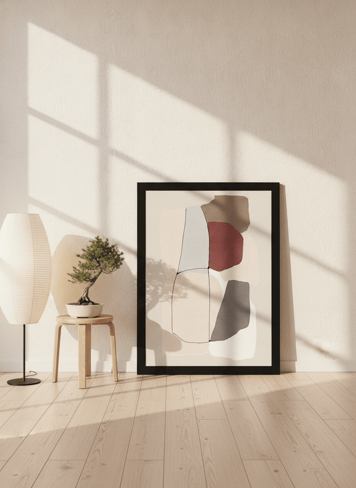 Oversized statement modern wall art print leaning against the wall in a warm Japandi bedroom